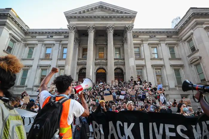 Black Lives Matter protesters on the steps of education department headquarters.
